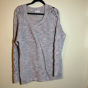 Pastel pink/blue/purple sweater with open cable detail on sleeve